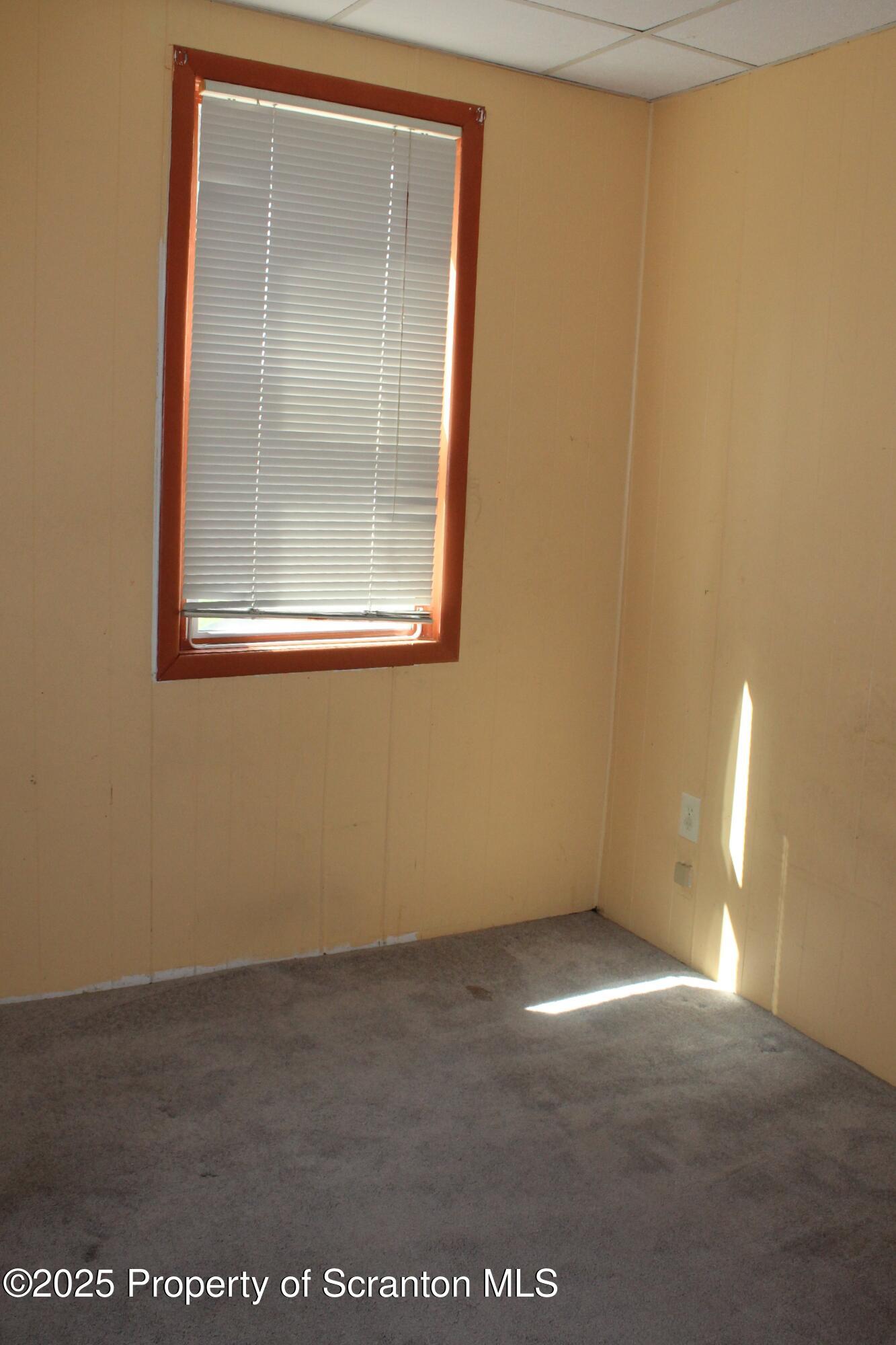 1919 Price Street Scranton, PA 18504 - Photo 22 of 44 a view of an empty room with a window