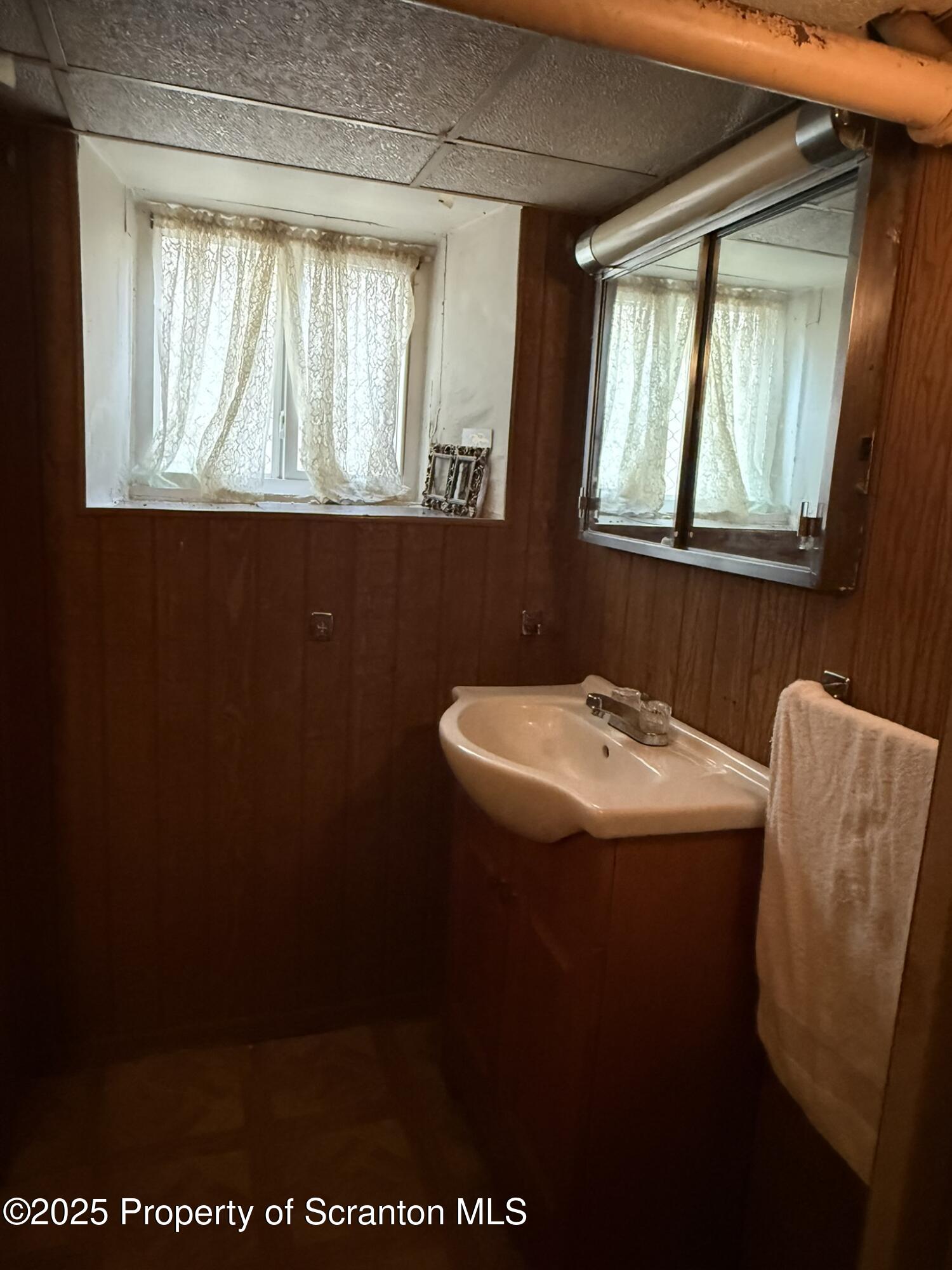 1919 Price Street Scranton, PA 18504 - Photo 33 of 44 a bathroom with a sink and a mirror