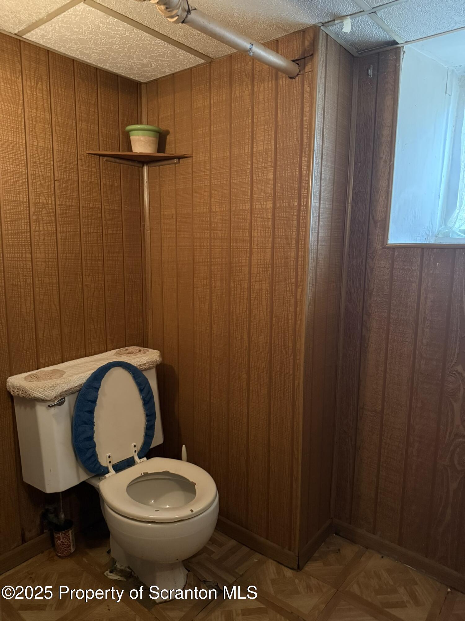 1919 Price Street Scranton, PA 18504 - Photo 34 of 44 a bathroom with a toilet a sink and shower