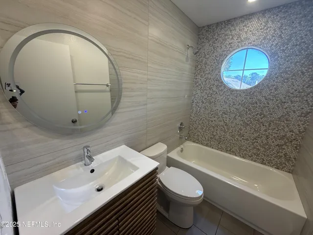 a bathroom with a sink and bathtub