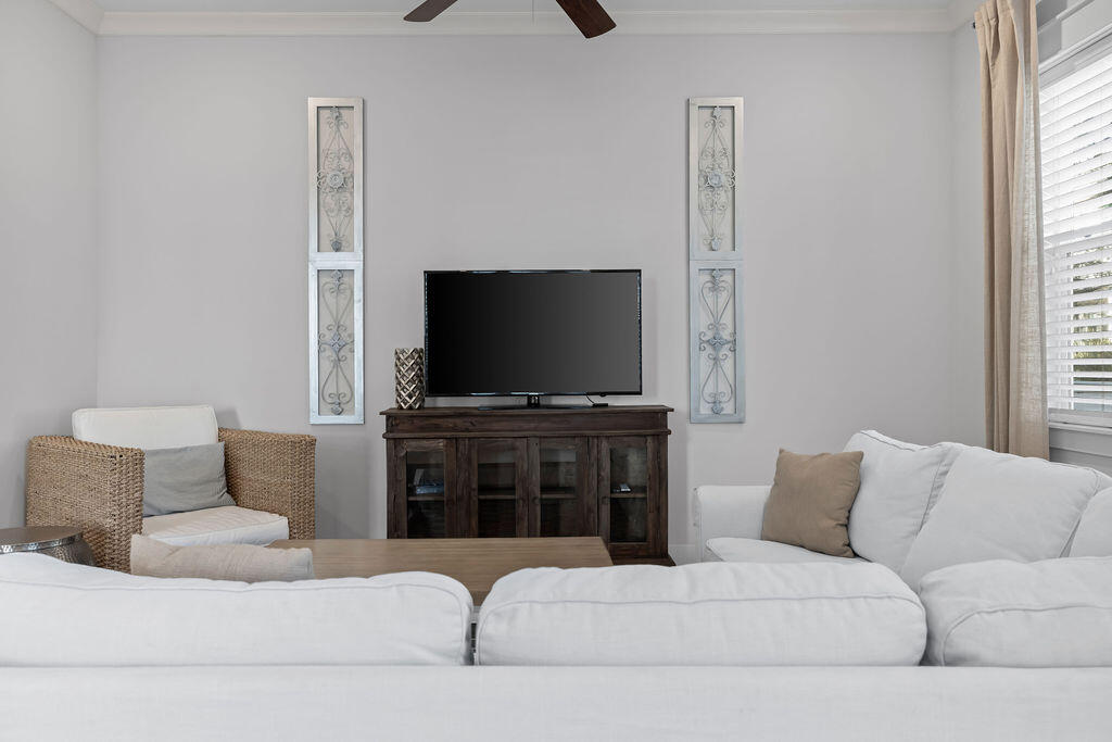 10 York Ln Inlet Beach, Unit B Inlet Beach, FL 32461 - Photo 2 of 46 a living room with furniture and a flat screen tv