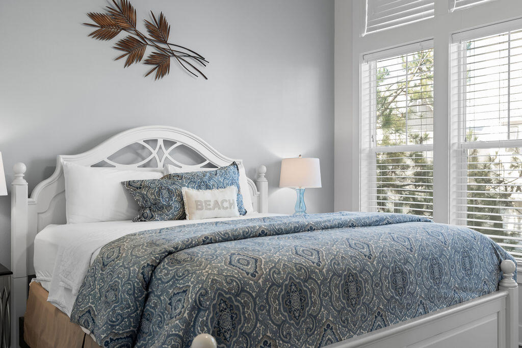 10 York Ln Inlet Beach, Unit B Inlet Beach, FL 32461 - Photo 21 of 46 a bedroom with a bed and a chandelier