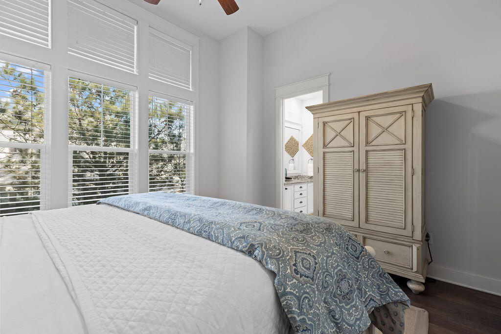 10 York Ln Inlet Beach, Unit B Inlet Beach, FL 32461 - Photo 22 of 46 a bedroom with a bed and wooden floor