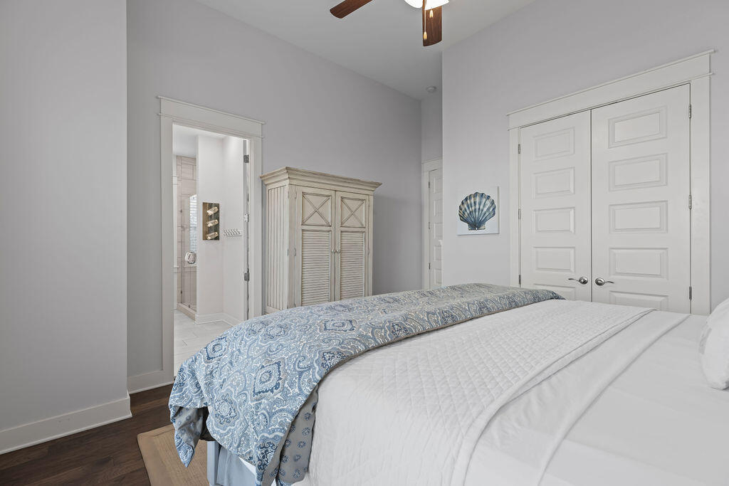 10 York Ln Inlet Beach, Unit B Inlet Beach, FL 32461 - Photo 24 of 46 a bedroom with a bed and a chandelier