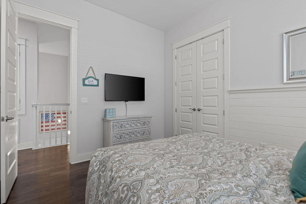 10 York Ln Inlet Beach, Unit B Inlet Beach, FL 32461 - Photo 31 of 46 a bedroom with a bed and a flat screen tv