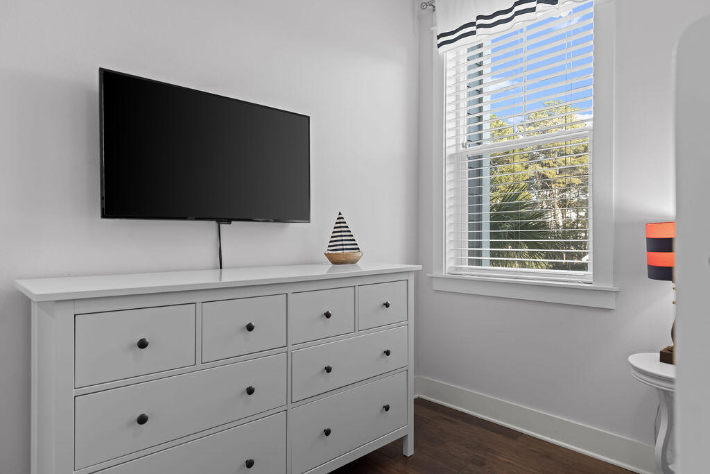 10 York Ln Inlet Beach, Unit B Inlet Beach, FL 32461 - Photo 32 of 46 a living room with flat screen tv and a window