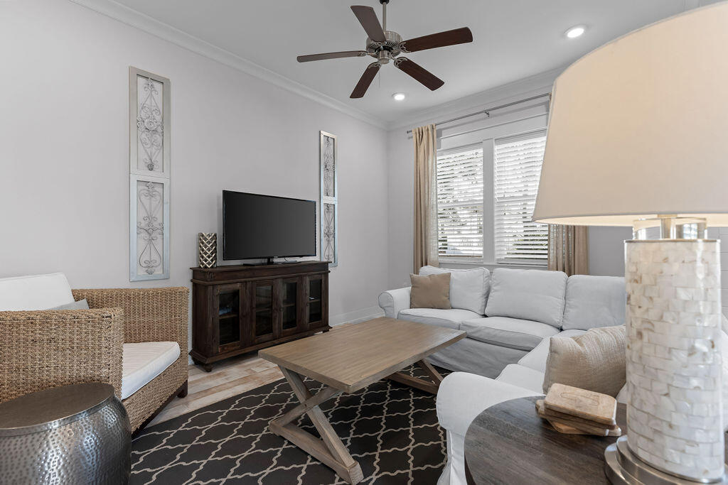 10 York Ln Inlet Beach, Unit B Inlet Beach, FL 32461 - Photo 4 of 46 a living room with furniture and a flat screen tv