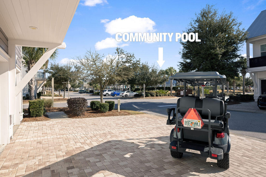 10 York Ln Inlet Beach, Unit B Inlet Beach, FL 32461 - Photo 43 of 46 a view of a chairs and tables in the patio and a fountain