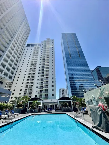a view of a patio with table and chairs a barbeque and potted plants