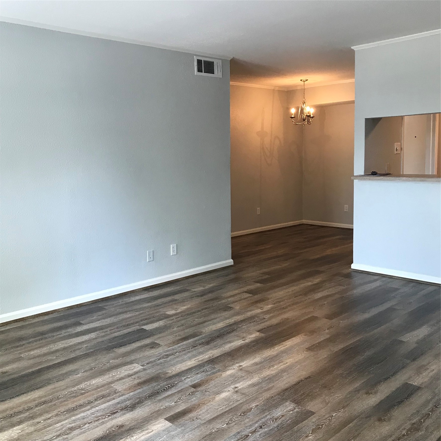 4631 Wild Indigo Street, Unit 560 Houston, TX 77027 - Photo 1 of 12 a view of empty room with wooden floor