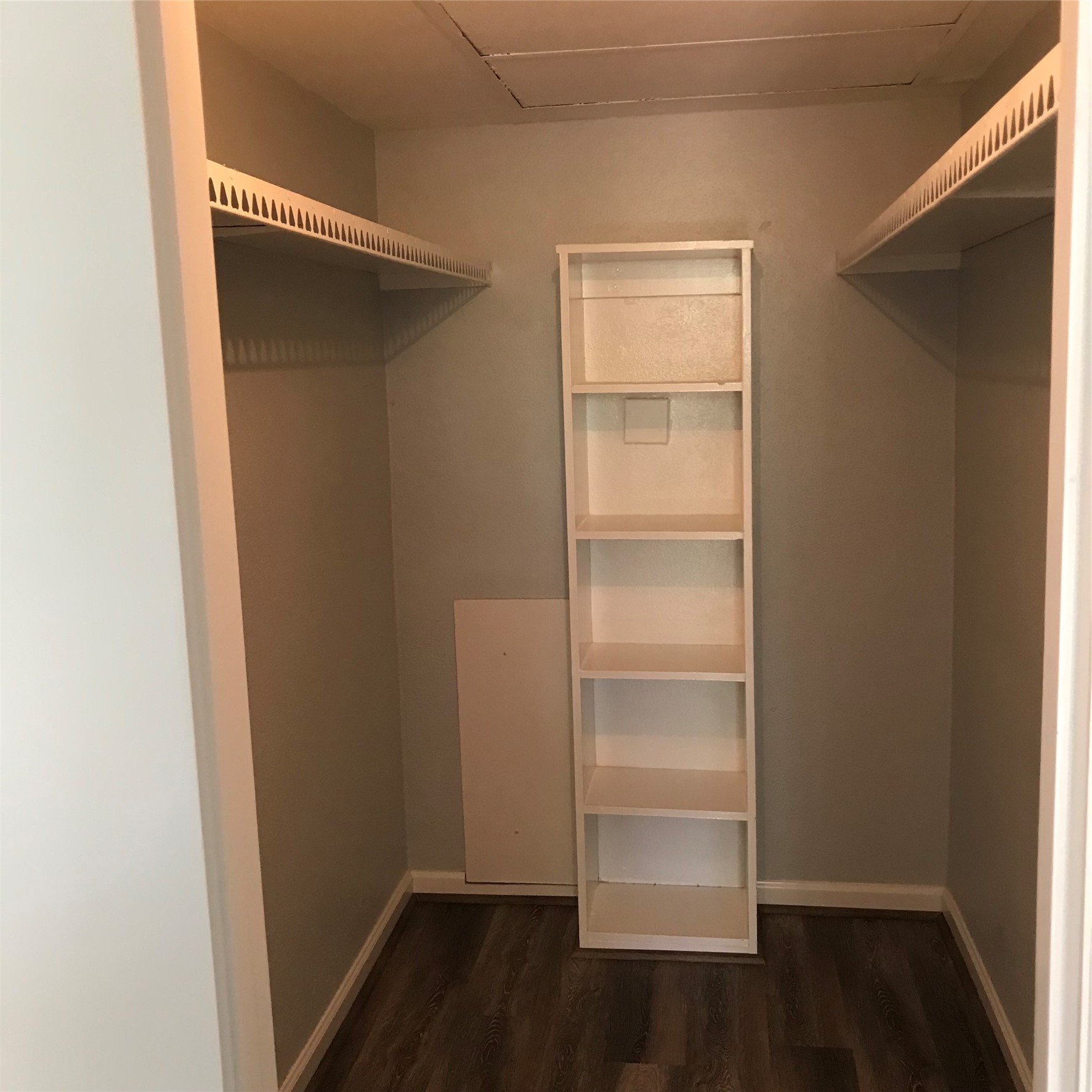 4631 Wild Indigo Street, Unit 560 Houston, TX 77027 - Photo 9 of 12 a view of walk in closet with empty racks
