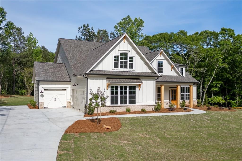 1210 Austin Road Winder, GA 30680 - Photo 3 of 56 a front view of a house with garden