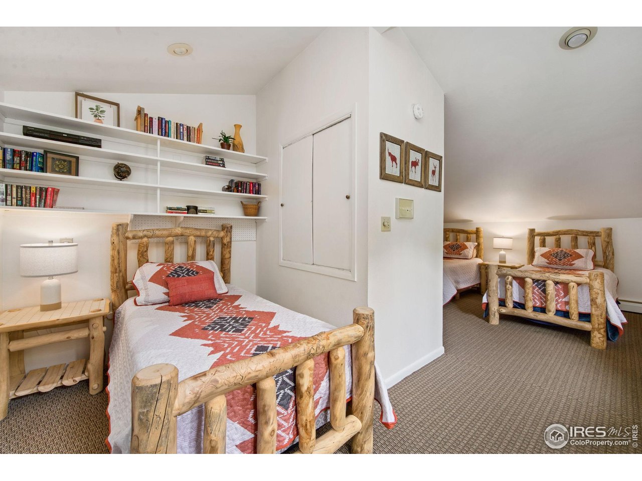 2760 Fall River Road, Unit 228 Estes Park, CO 80517 - Photo 23 of 37 Upstairs "bunk" room with two twin beds and a full bed.