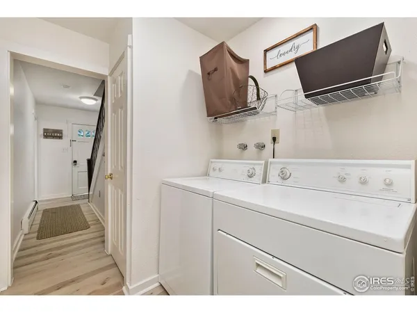 a view of an entryway with wooden floor
