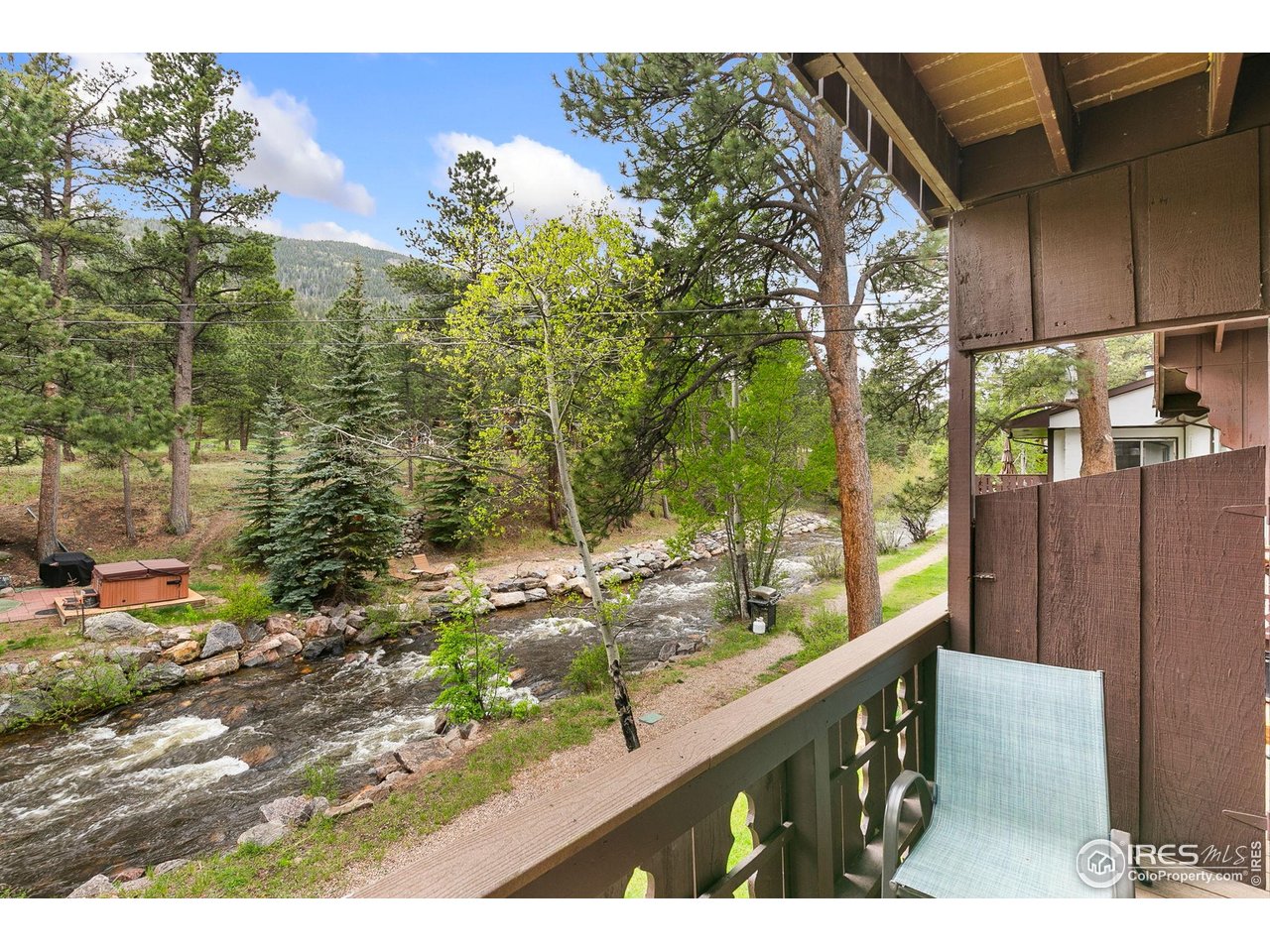 2760 Fall River Road, Unit 228 Estes Park, CO 80517 - Photo 5 of 37 Main floor deck with amazing river views!