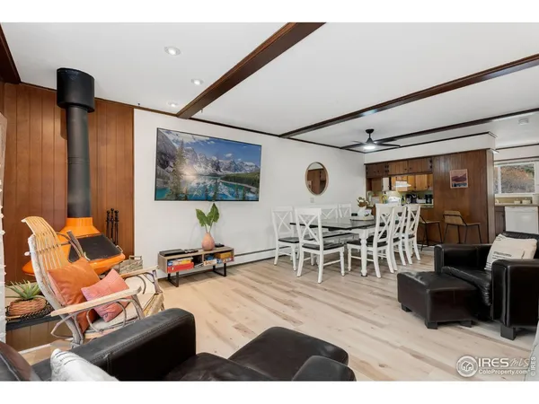 a dining room with furniture and window
