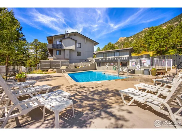 a balcony with table and chairs