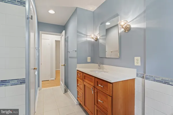a bathroom with a shower and a bath tub