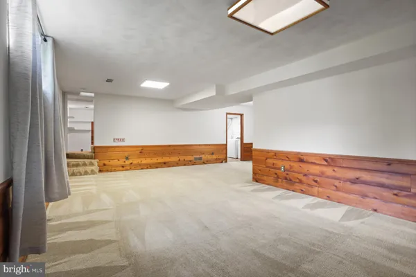 a view of an empty room with cabinet