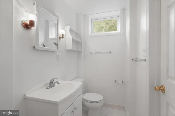 a bathroom with a sink a mirror and shower