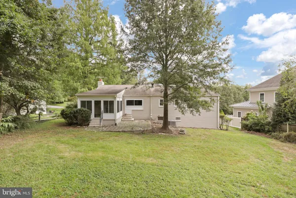 a house with trees in front of it