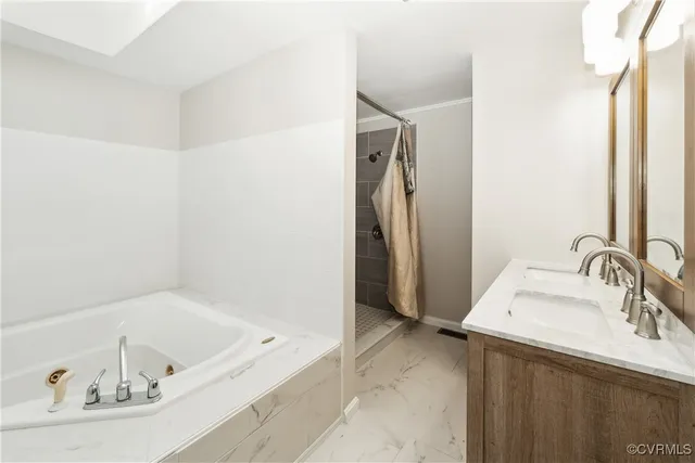 a bathroom with a tub sink and a mirror
