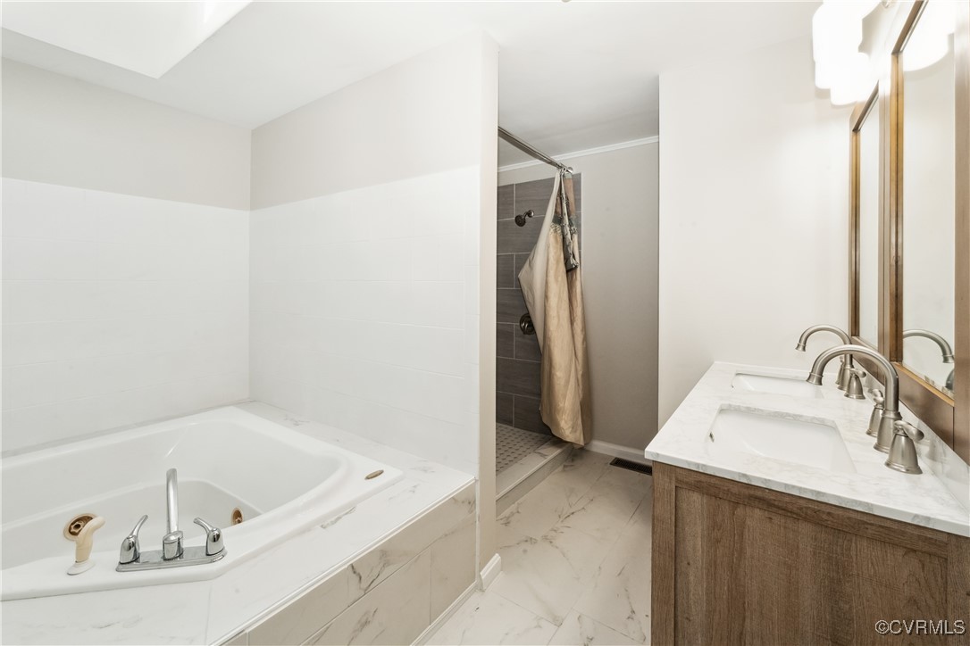 932 Eastern View Road St. Stephens Church, VA 23148 - Photo 11 of 17 a bathroom with a tub sink and a mirror