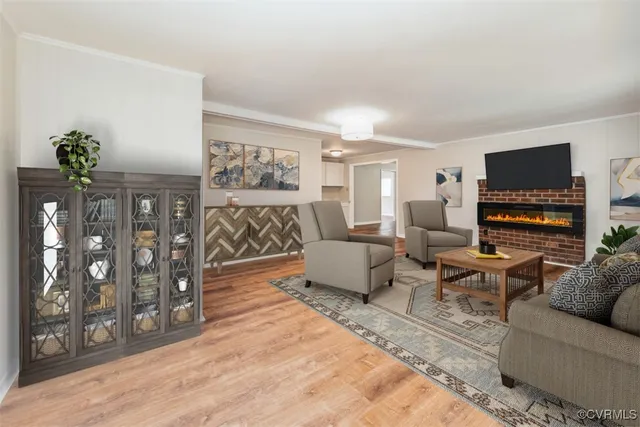 a living room with furniture a couch and a flat screen tv