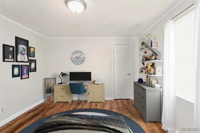 a bedroom with a bed and workspace