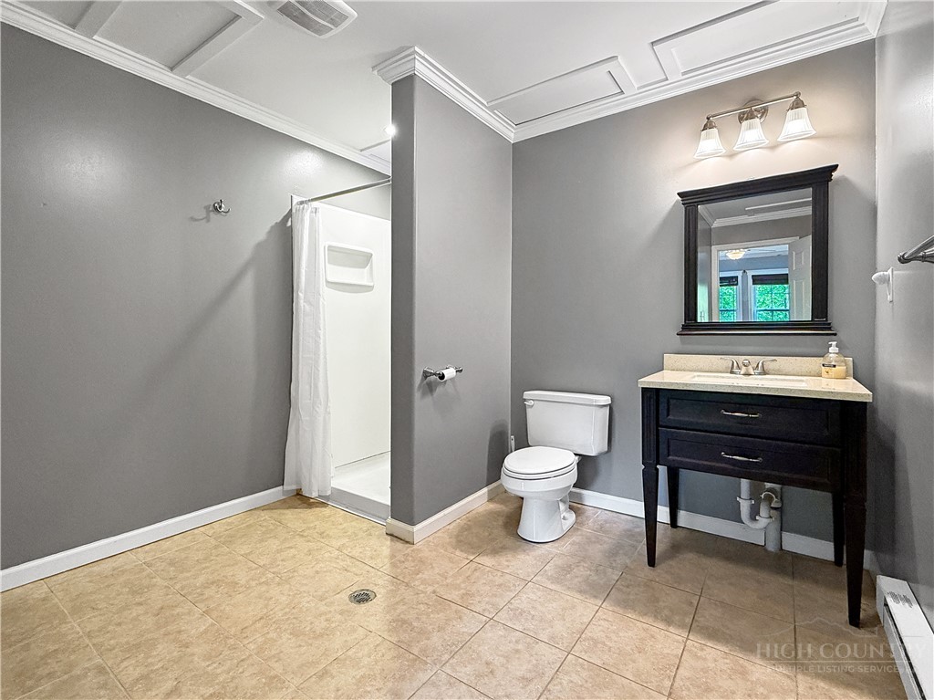 1173 Hopewell Church Road Boone, NC 28607 - Photo 27 of 39 a room with a piano table and chair