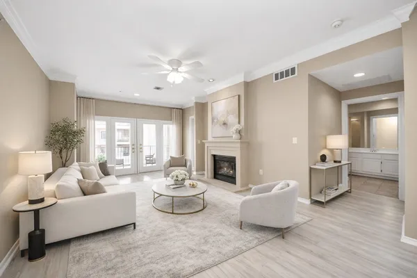 a living room with furniture and a fireplace