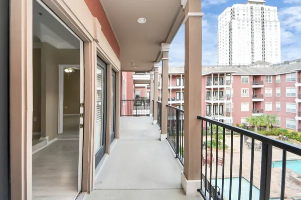a view of a big room with closet and wooden door
