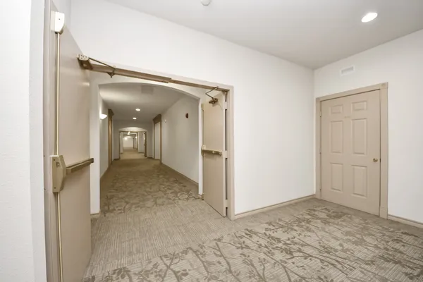 a view of hallway with closet