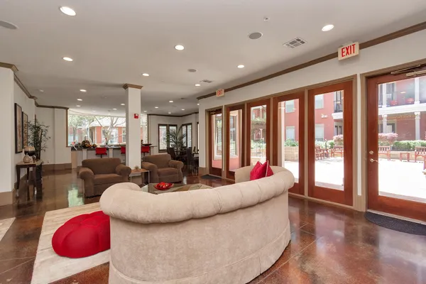 a living room with lots of wooden furniture