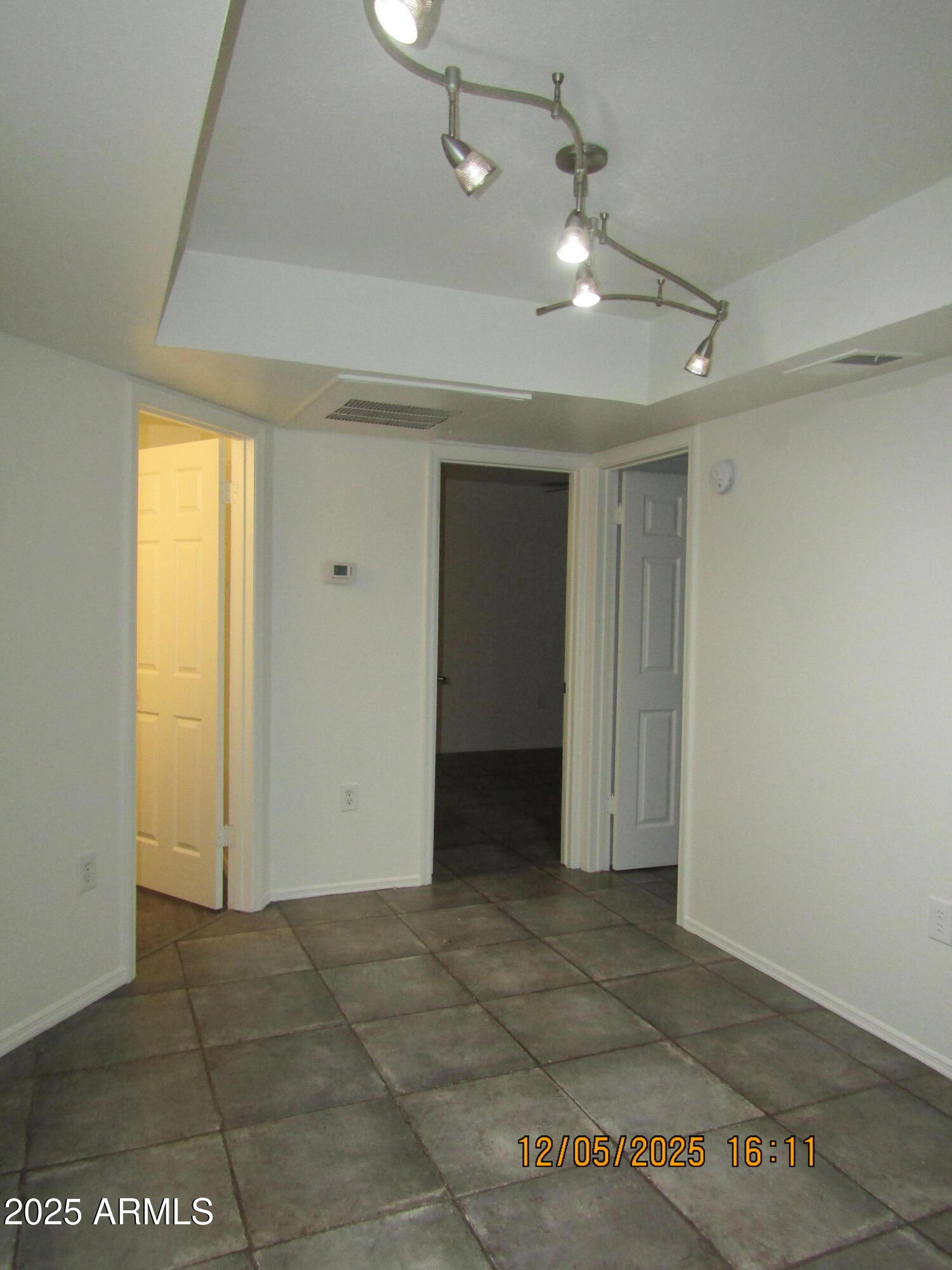 1331 West Baseline Road, Unit 102 Mesa, AZ 85202 - Photo 6 of 13 a view of a livingroom with a chandelier