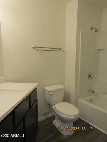 a bathroom with a toilet a sink and bathtub