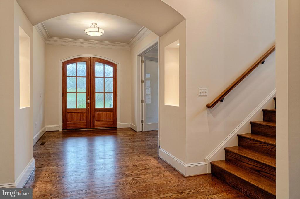 Entrance Foyer with Arched Mahogany Door
