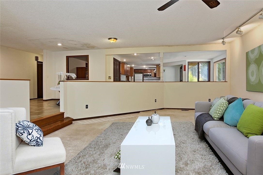 1000 Duchess Road Bothell, WA 98012 - Photo 12 of 35 a living room with furniture and a couch