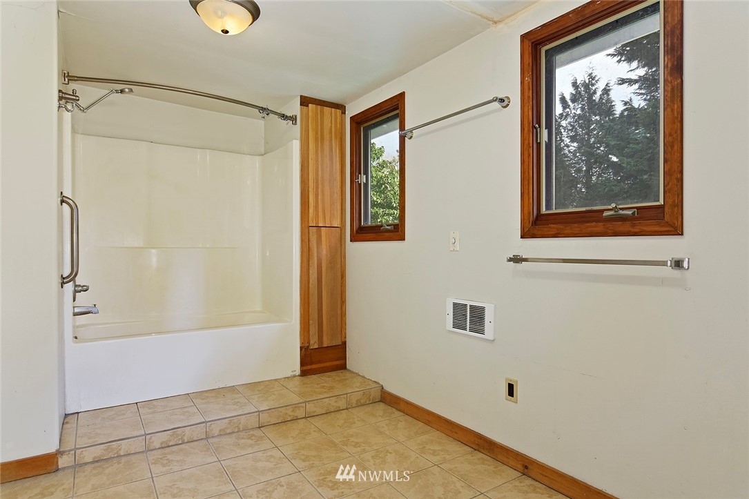 1000 Duchess Road Bothell, WA 98012 - Photo 23 of 35 a view of an empty room with window and bathroom