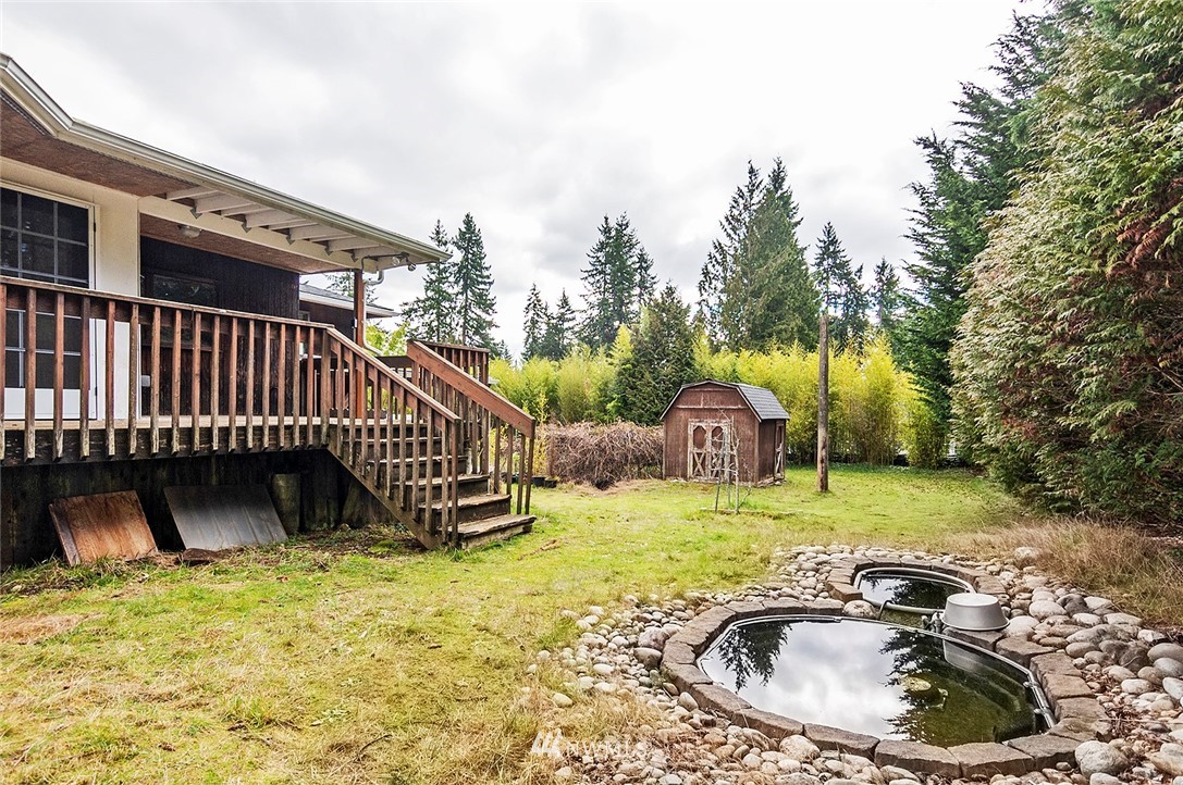 1000 Duchess Road Bothell, WA 98012 - Photo 25 of 35 a view of a swimming pool with a patio and a yard