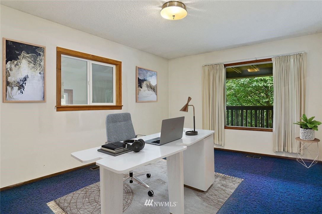 1000 Duchess Road Bothell, WA 98012 - Photo 26 of 35 a room with furniture and wooden floor