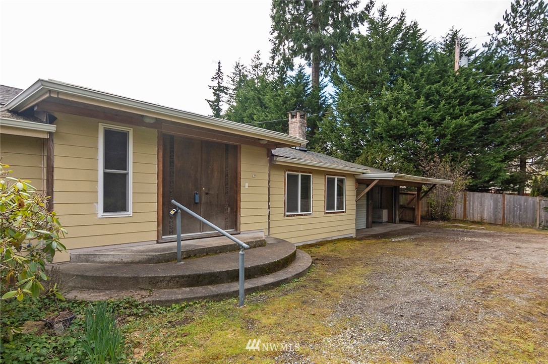 1000 Duchess Road Bothell, WA 98012 - Photo 33 of 35 a front view of house with deck and yard