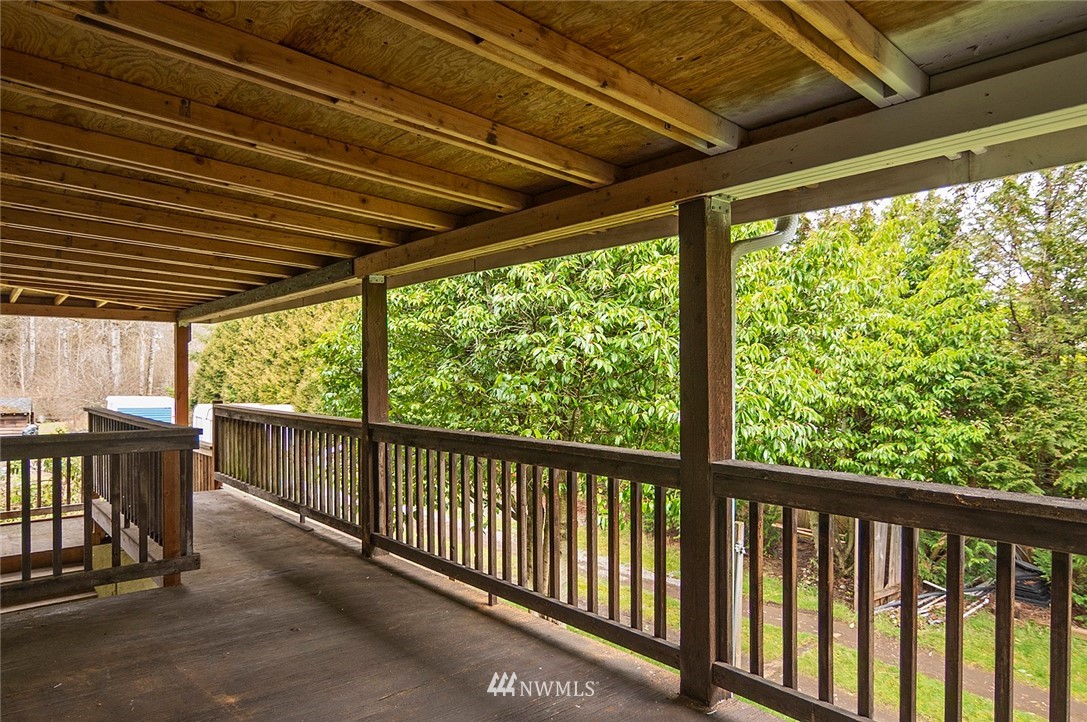 1000 Duchess Road Bothell, WA 98012 - Photo 34 of 35 a view of a porch with furniture and wooden roof