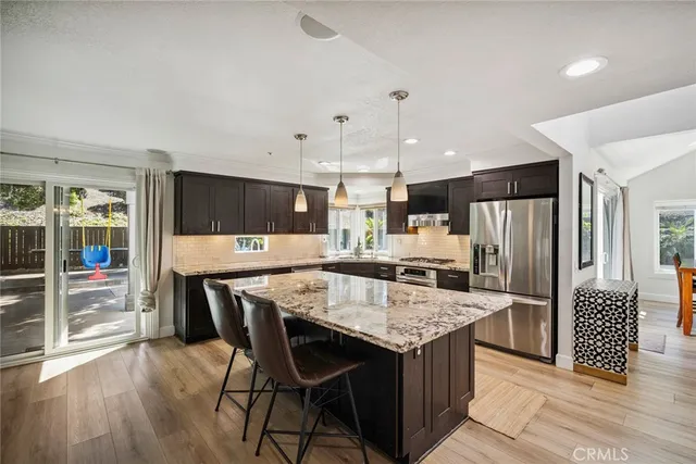a kitchen with a table and chairs in it