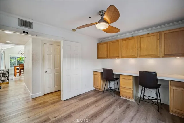 a workspace with furniture and window