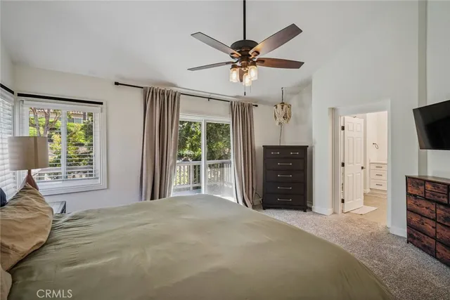 a bathroom with a shower sink and mirror