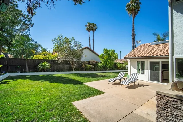a view of a house with backyard and a slide