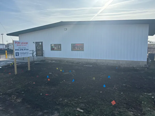 a swimming pool with outdoor seating and yard