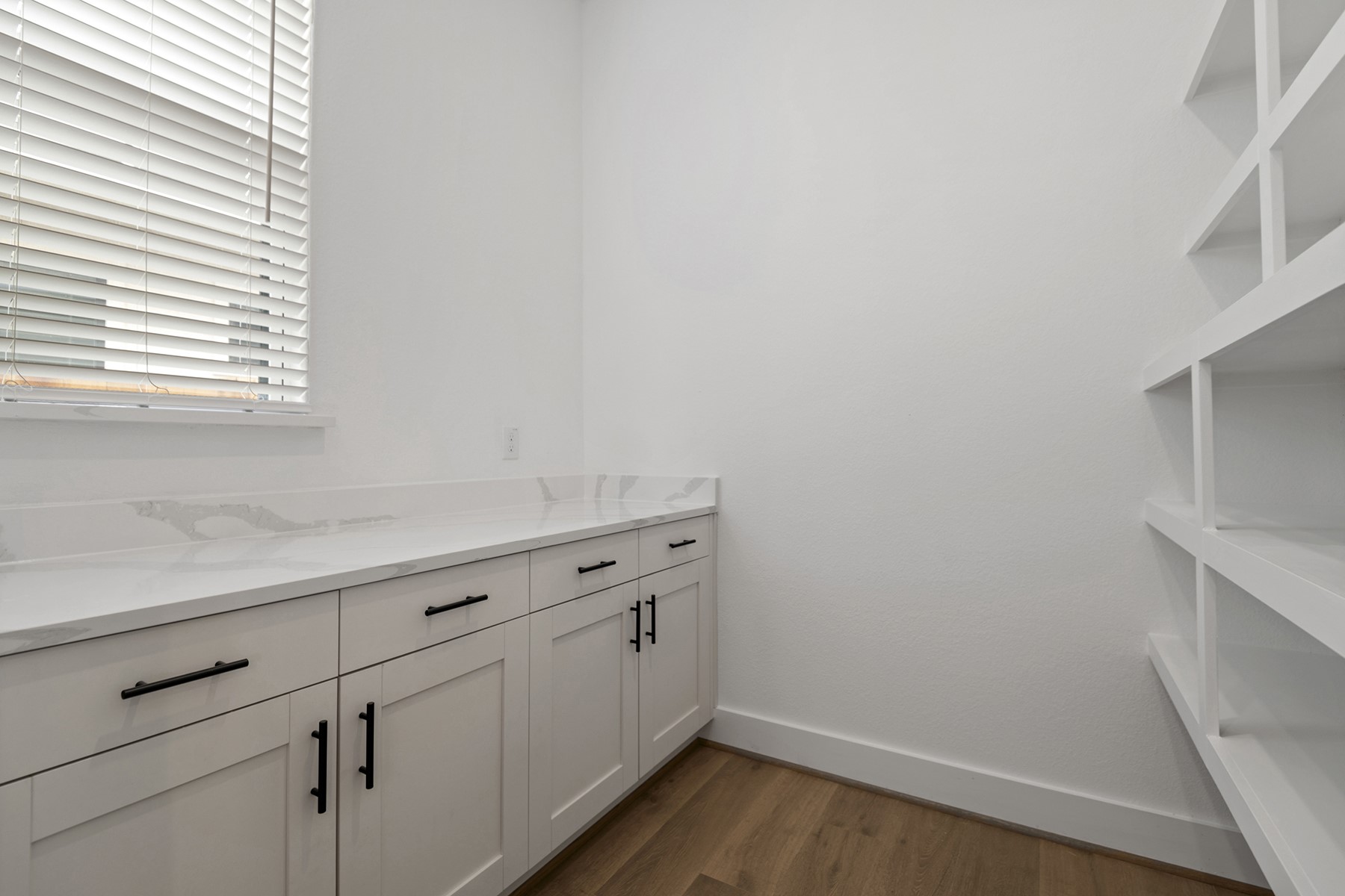1911 Drover Lane Rosenberg, TX 77471 - Photo 13 of 22 a view of storage and utility room with wooden floor