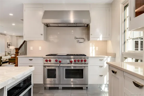 a kitchen with a stove and a sink